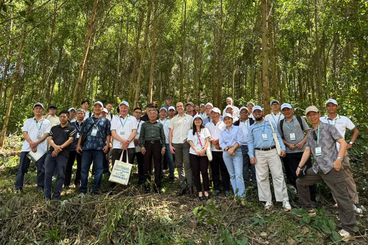 Conference group on a field trip to a plantation.