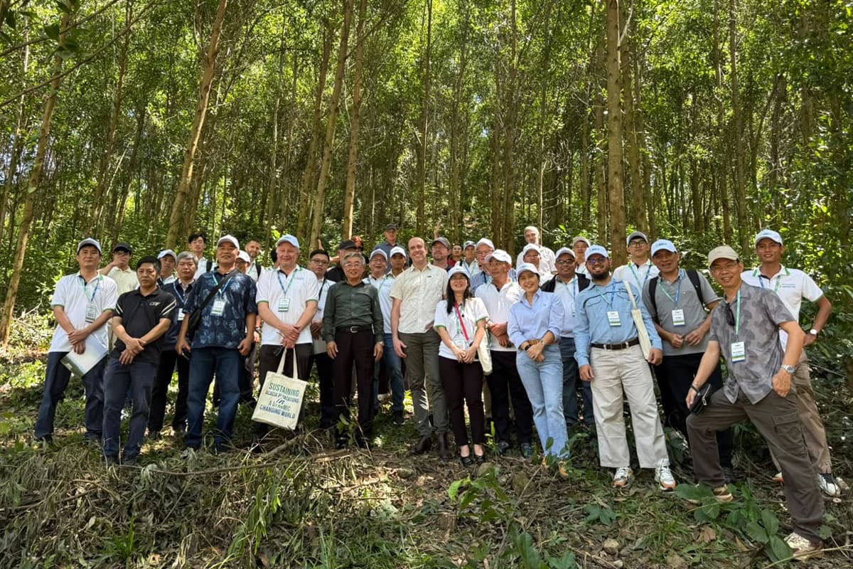Conference group on a field trip to a plantation.