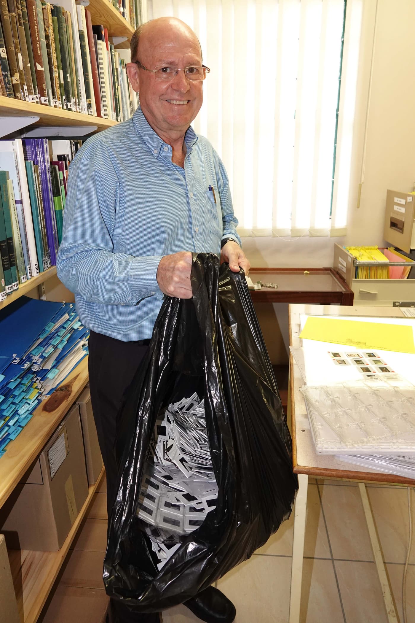 Mike Wingfield starts sorting through the FABI slide collection