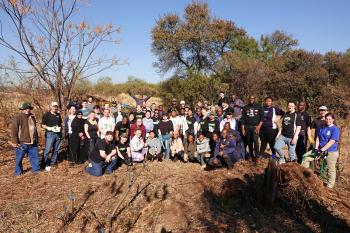 FABIans pitch in to clear invasive woody plants on Mandela Day